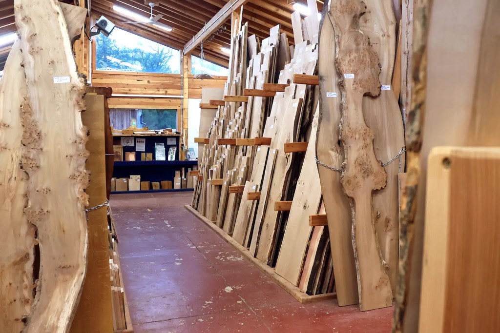 Homegrown Scottish hardwood boards with live edges in a shop