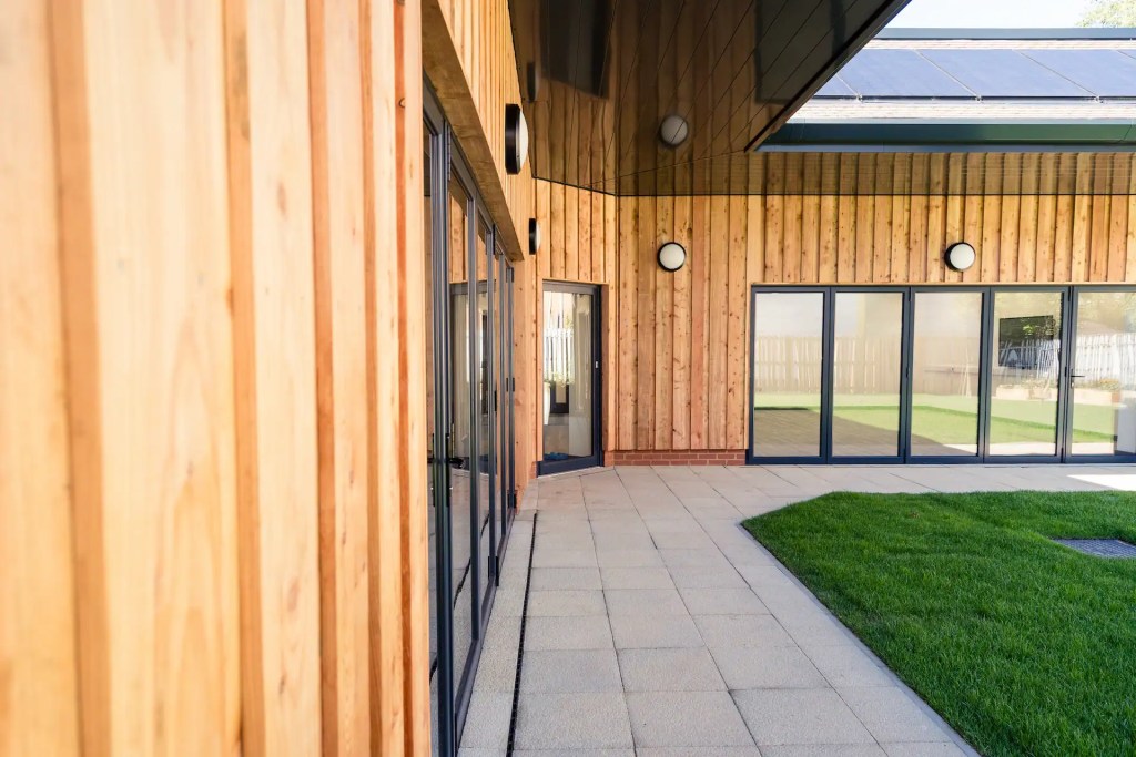 Building glad with shadow gap larch cladding