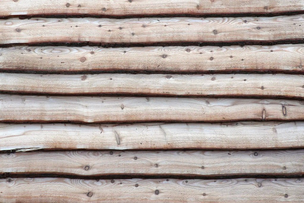 Sample of Larch waney edge cladding on wall