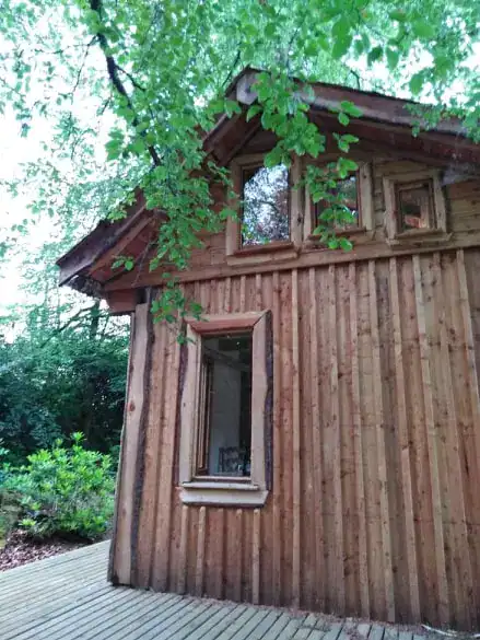 Garden hut clad with batten on board Scottish larch cladding