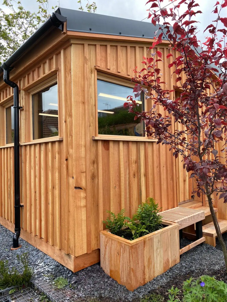 Garden room freshly clad in batten on board larch cladding