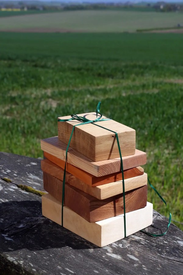 Small stack of Scottish hardwoods, wrapped in a ribbon and ready to be gifted