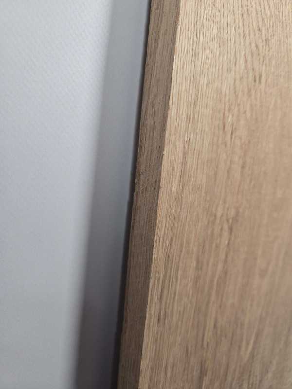 Small straight edge oak offcut showing natural wood grain and smooth finish.