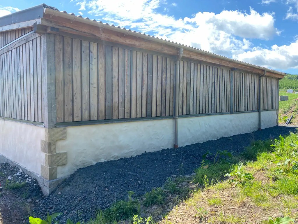 Exterior farm building with board on board Scottish Larch cladding which has weathered to silvery grey