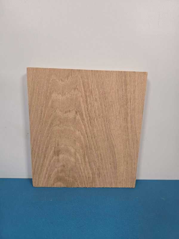 Small straight edge oak offcut showing natural wood grain and smooth surface.