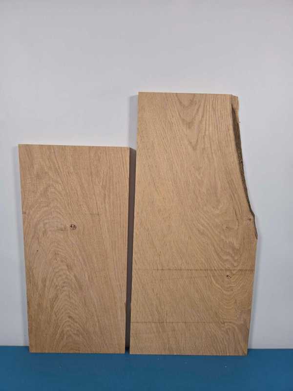 Two oak timber offcuts with smooth planed surfaces and natural wood grain.