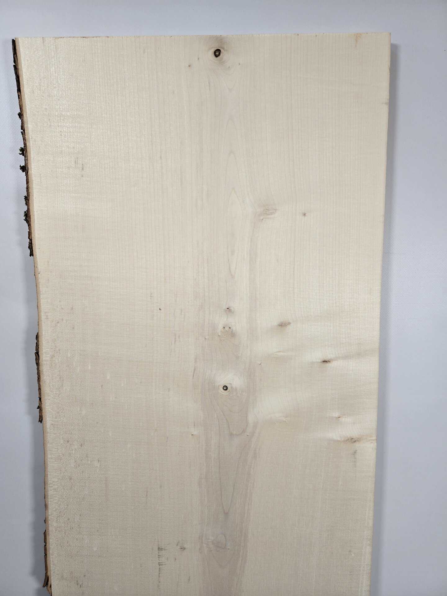 Natural edge Sycamore timber board with live edge and smooth surface.