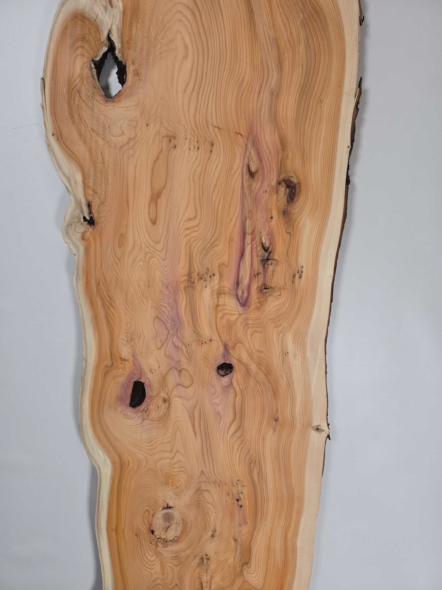 Bold Yew timber board with natural edges and visible grain patterns.