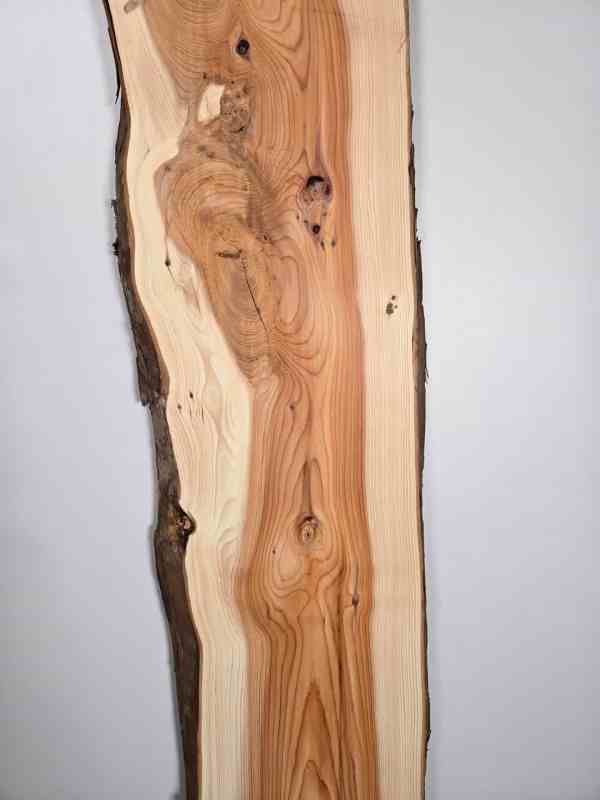 Narrow Yew timber board with natural edge and detailed grain pattern.