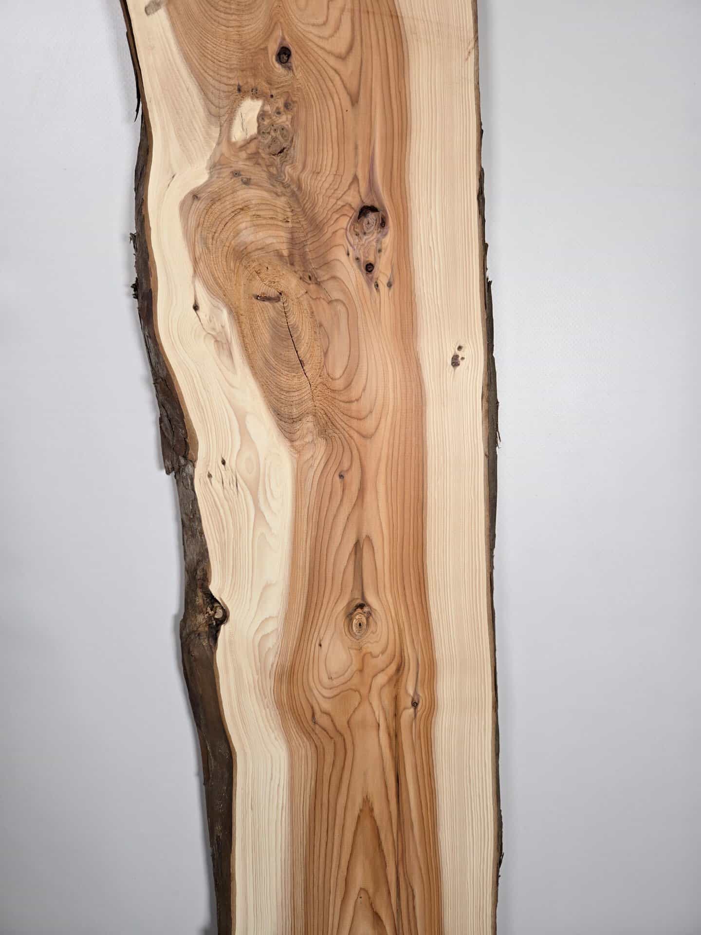 Narrow Yew timber board with natural edge and detailed grain pattern.