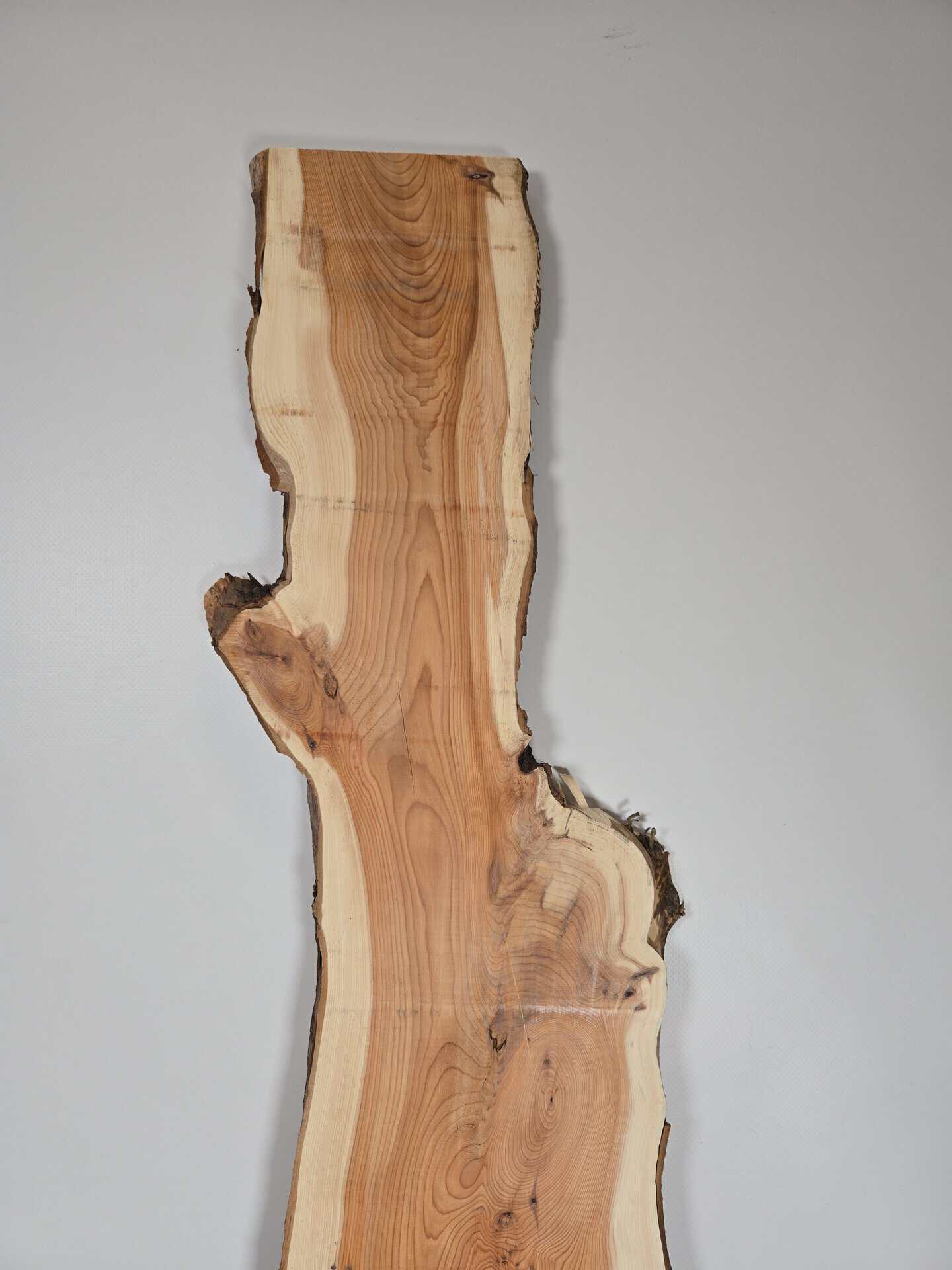 Narrow yew timber board with natural edges and visible grain pattern.