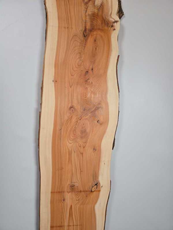 Narrow Yew timber board with natural edge and detailed grain pattern.
