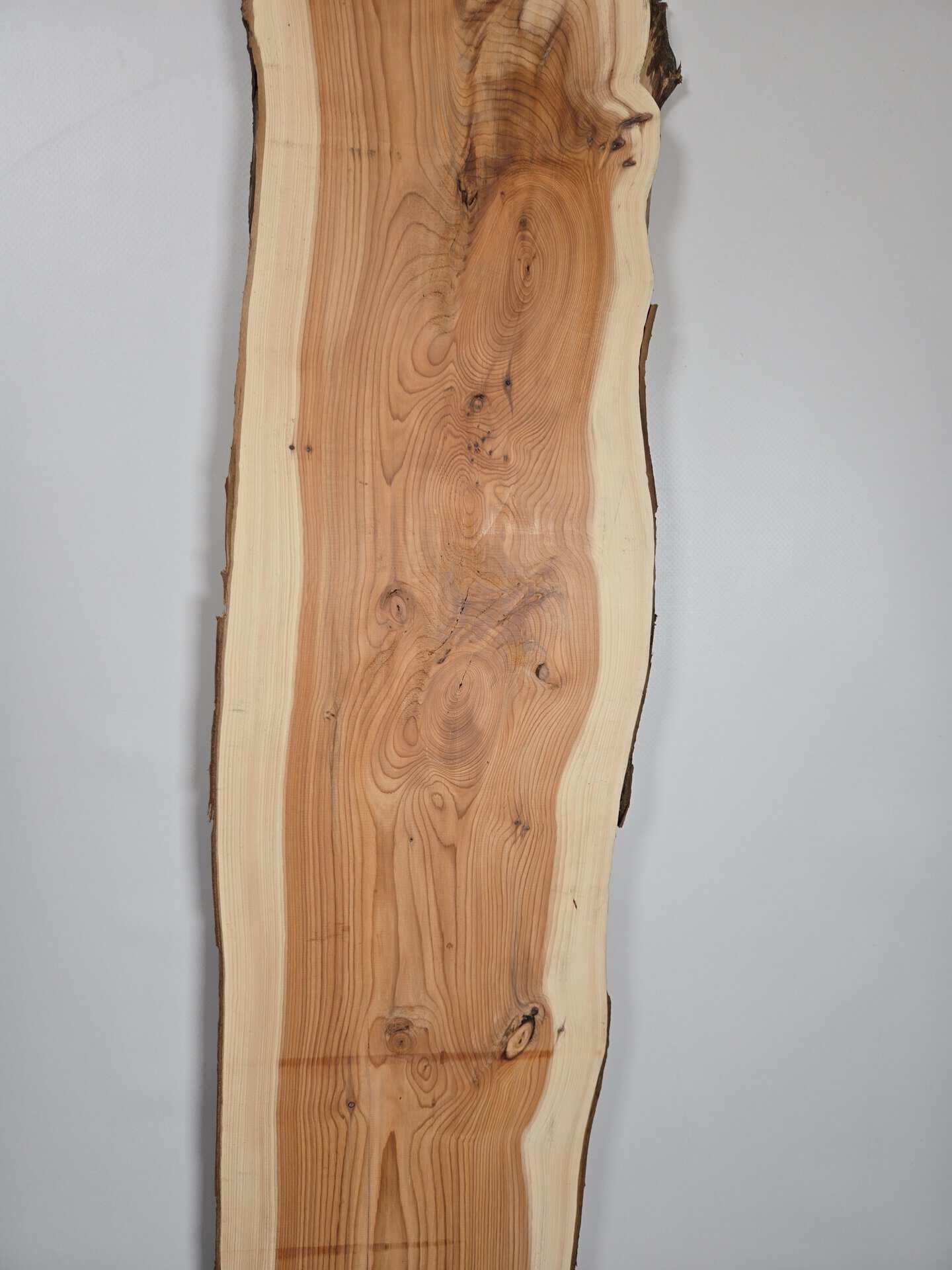 Narrow Yew timber board with natural edge and detailed grain pattern.
