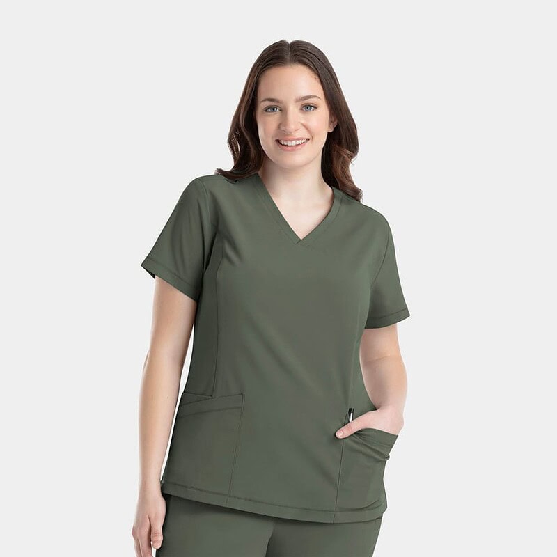 Woman in olive green scrubs