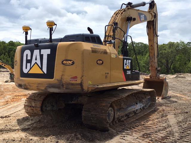Caterpillar excavator on construction site showcasing professional site development and heavy equipment for earthmoving projects.