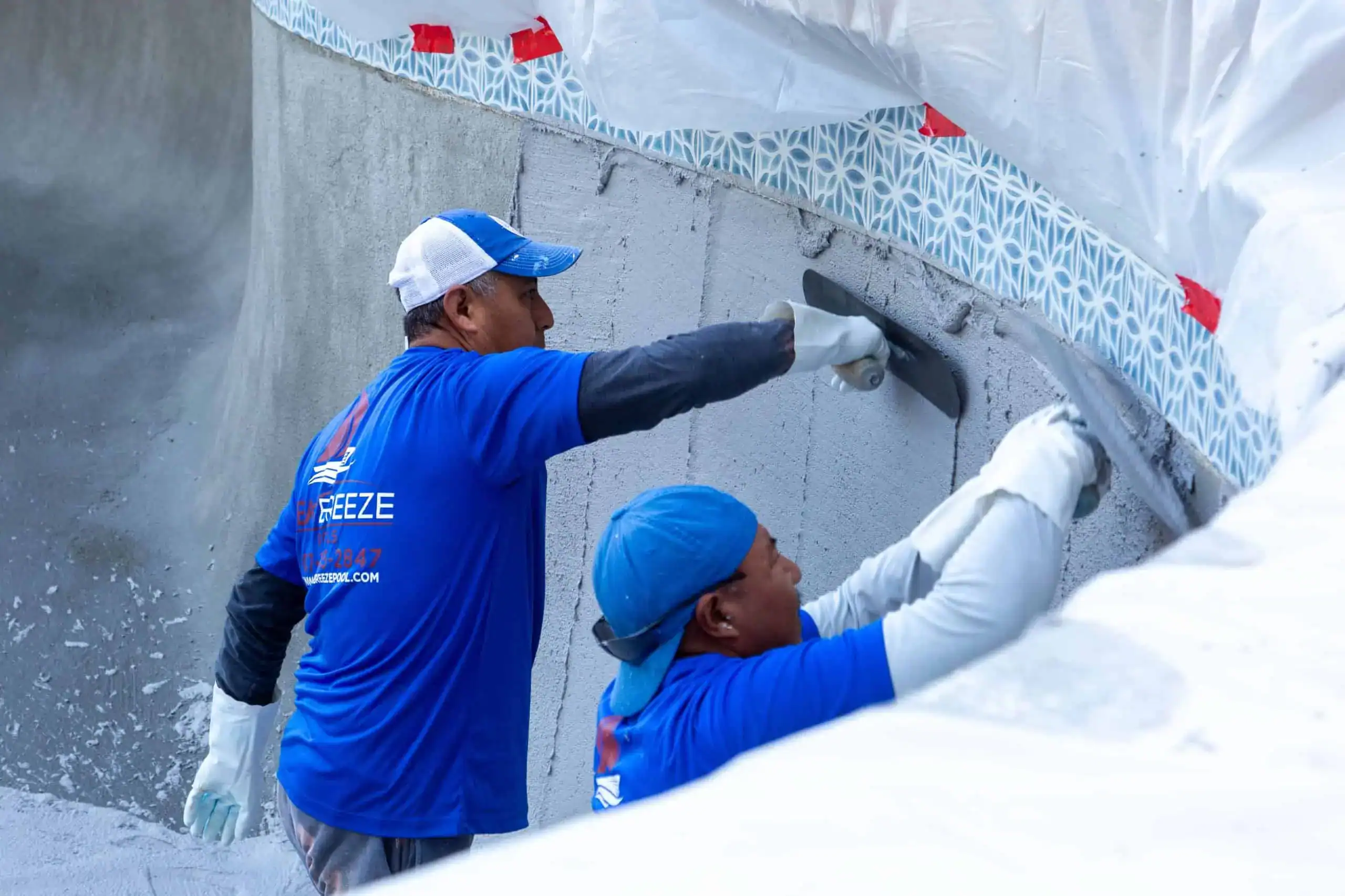 Pool remodel vs pool repair crew working on a pool in Orlando