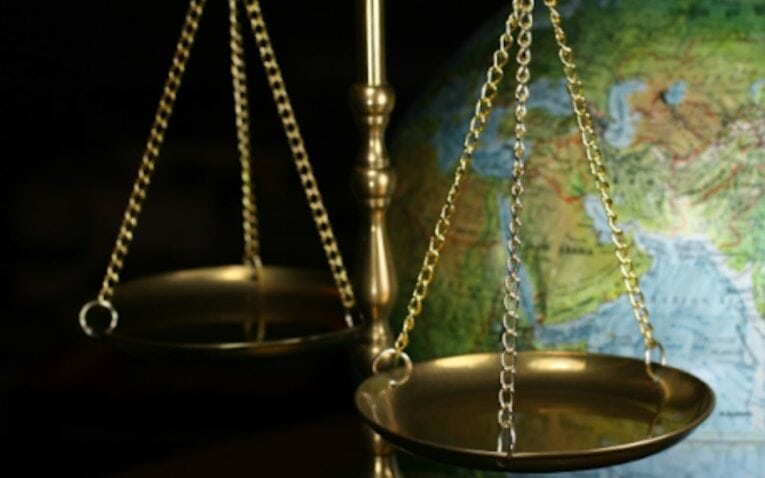 a globe and a scale