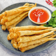 a plate of fried food with sauce