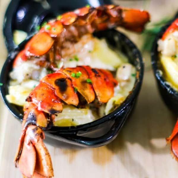 lobster tail in a black bowl