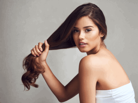 a woman holding her hair