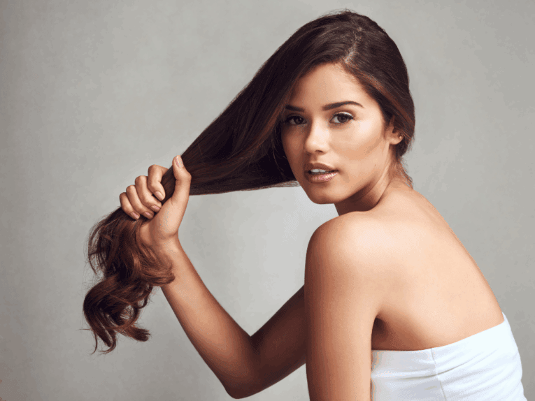 a woman holding her hair