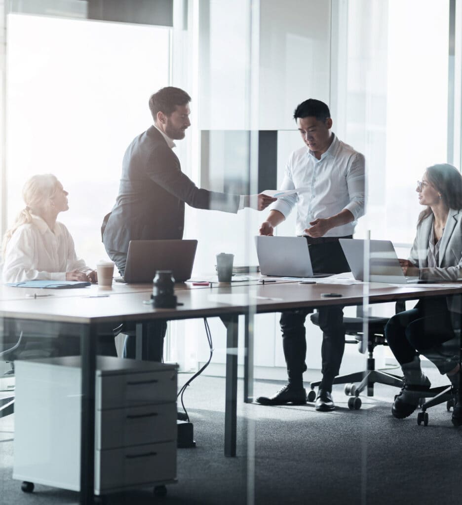 Meeting presentation and teamwork at modern corporate office.