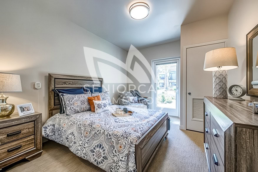 Single Bedroom with Light and door to outside at Merrill Gardens Rancho Cucamonga