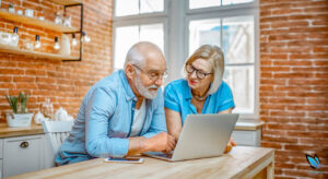 Senior Couple searching for an assisted living facility from their computer