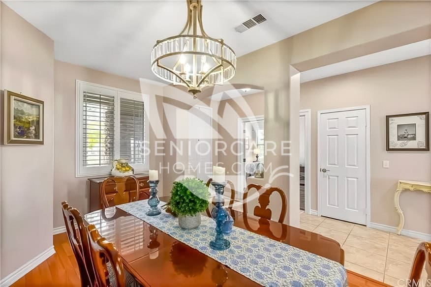 Elegant dining room with chandelier at Cathy's Cottage