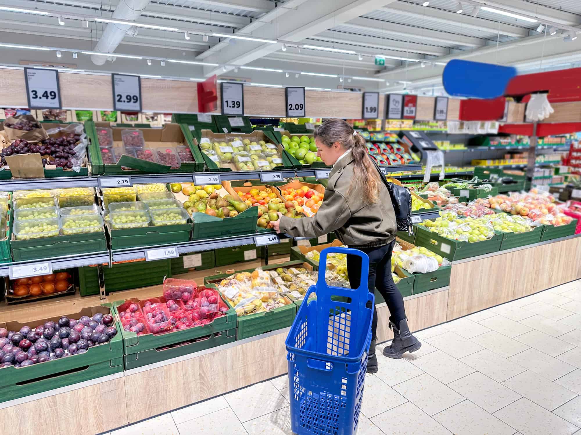 A woman doing the grocery shopping in a supermarket