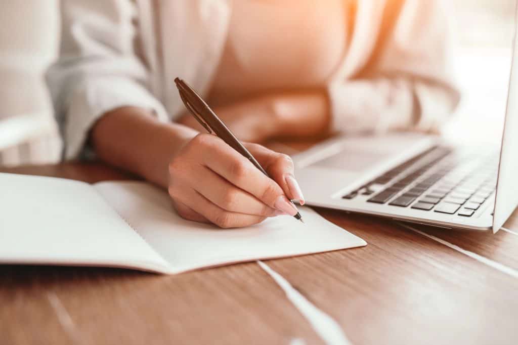 A woman working at her desk with her laptop