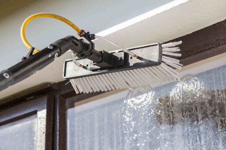 High level window cleaning using professional equipment for spotless results.