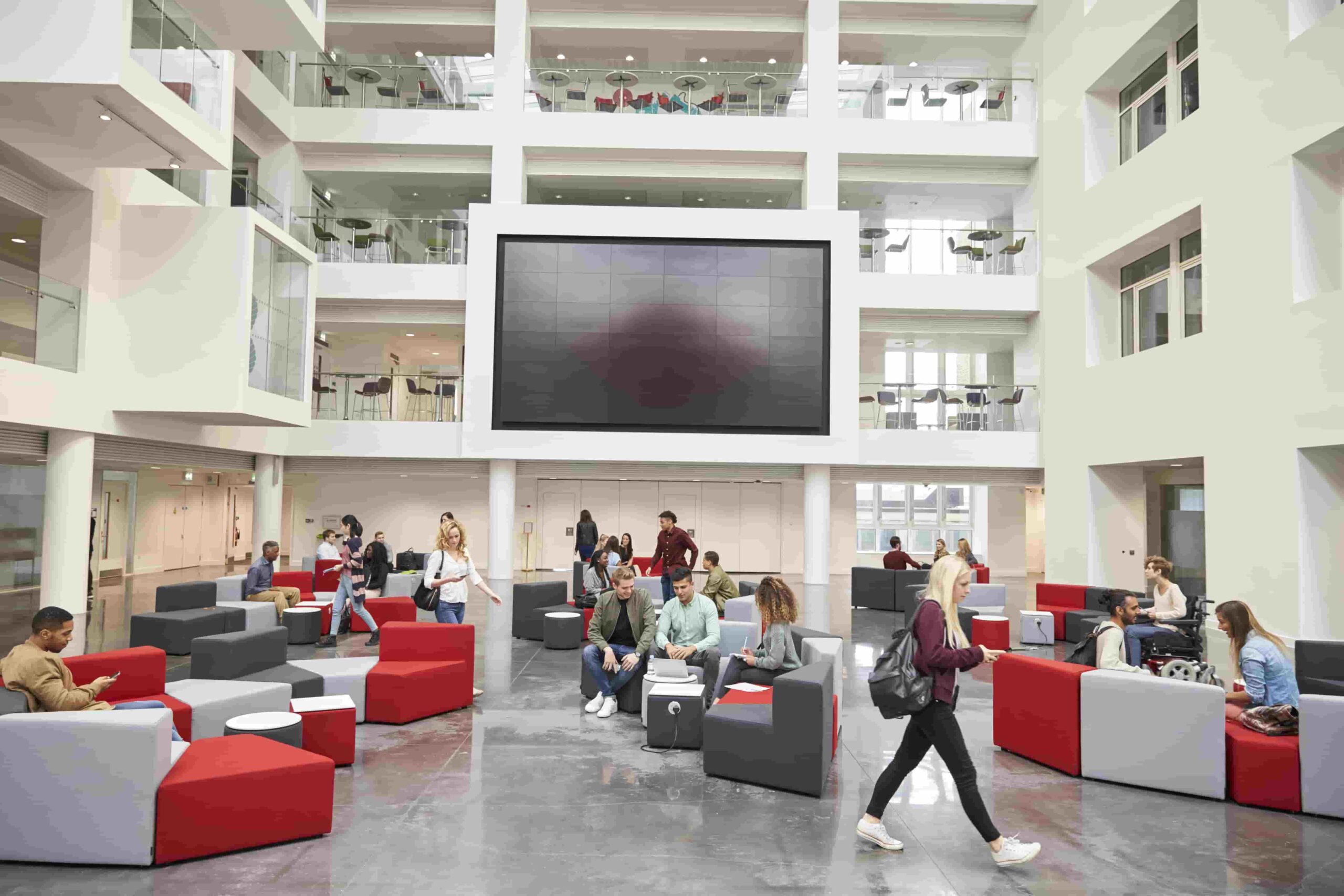 Spacious modern university lobby with fabric seating