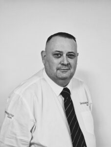Professional team member at Servicemaster Manchester in uniform.
