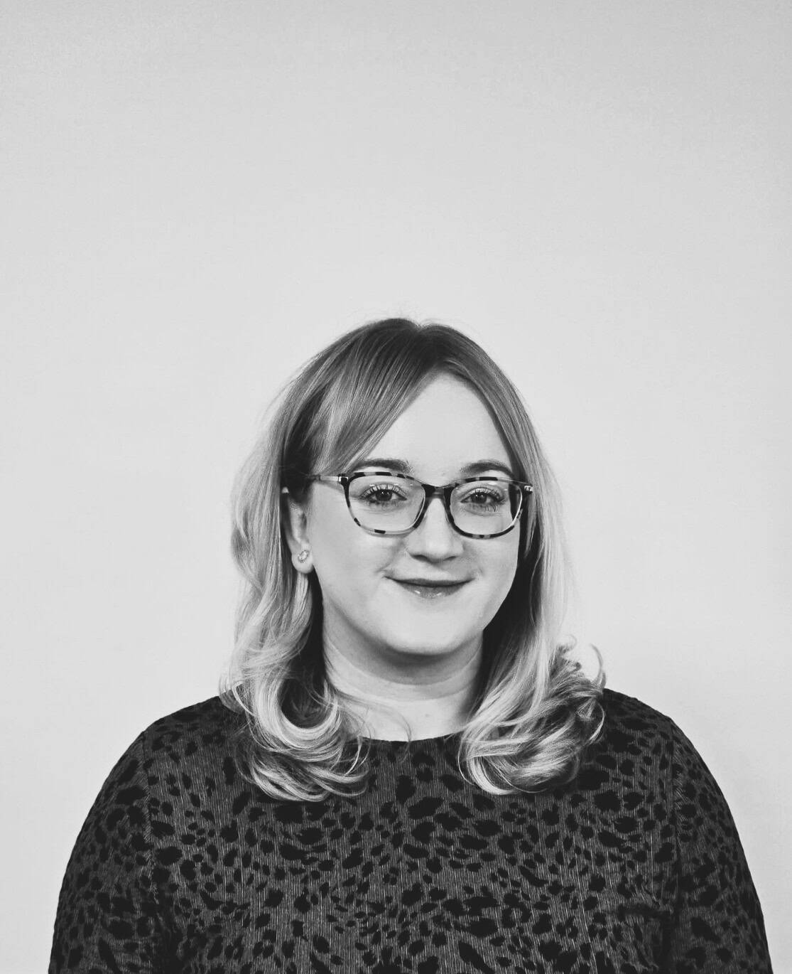 Professional team member from ServiceMaster Manchester smiling confidently.