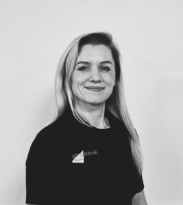 Female team member from ServiceMaster Manchester smiling confidently.