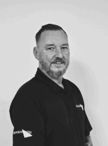 Professional team member from ServiceMaster Manchester, focused on cleaning services.
