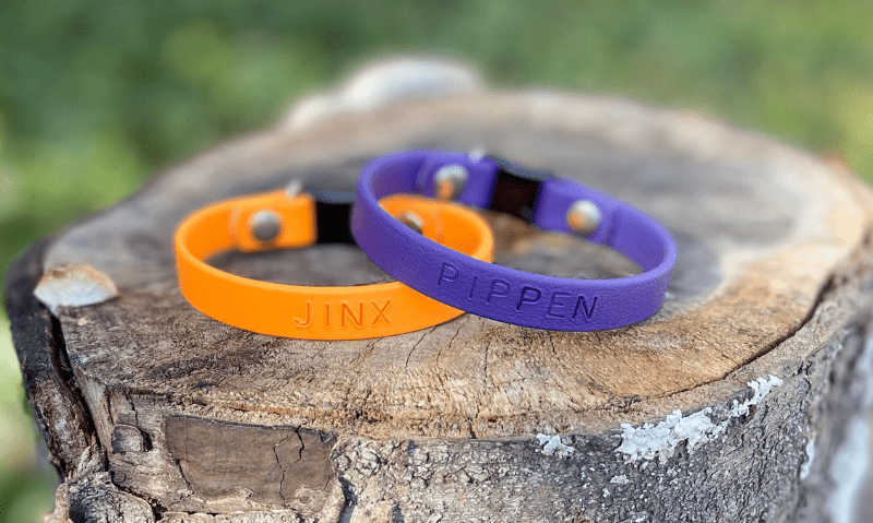 two biothane collars sitting on a stump | 5 Benefits of Biothane Collars for Dogs and Cats