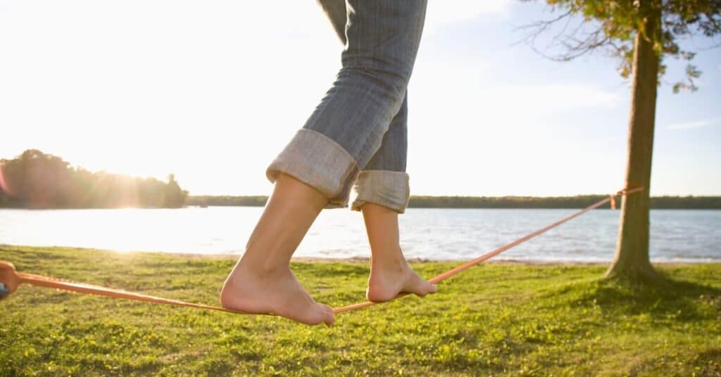 woman balancing on slackline