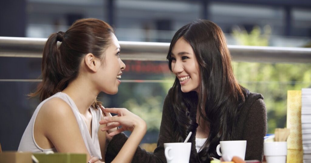 two women socializing over coffee