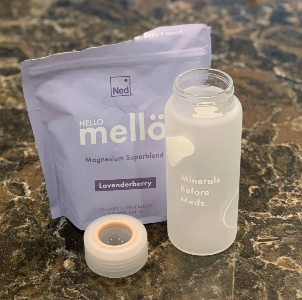 Ned's Magnesium in Lavenderberry flavor, glass bottle and cap on counter