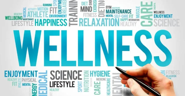 hand with pen writing words related to wellness