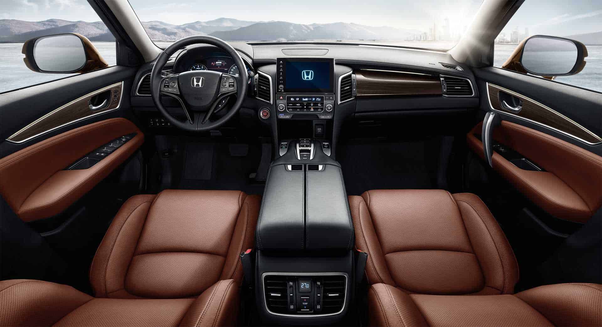 Interior dashboard and steering wheel of Honda Avancier with custom accessories.