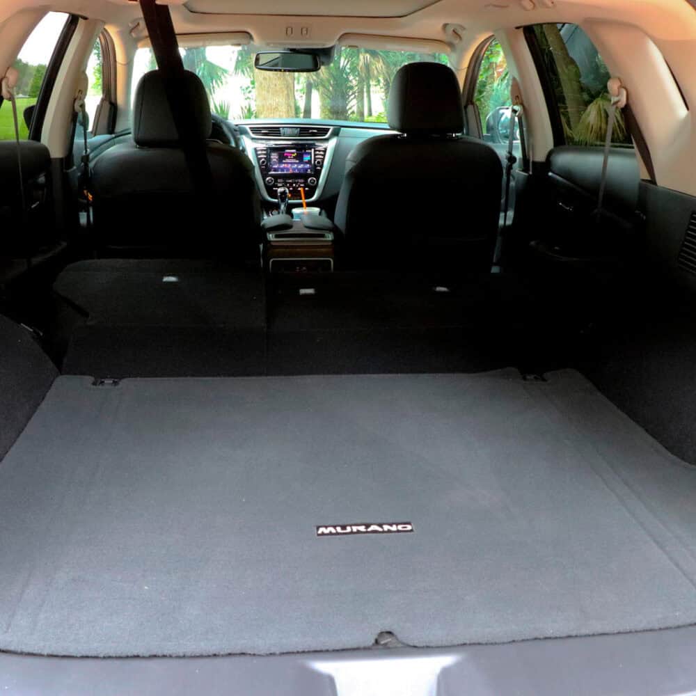 Nissan Murano trunk cargo area with luggage kit installed for protection and organization.