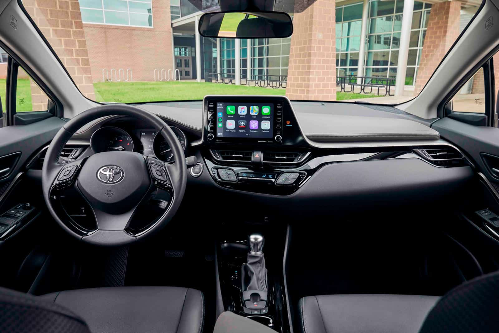 Interior dashboard of Toyota C-HR with custom kit, touchscreen display, and modern design.
