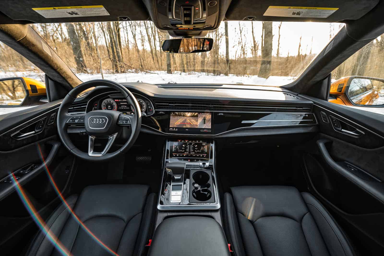 Audi Q8 interior dashboard and steering wheel with modern design and high-quality materials.