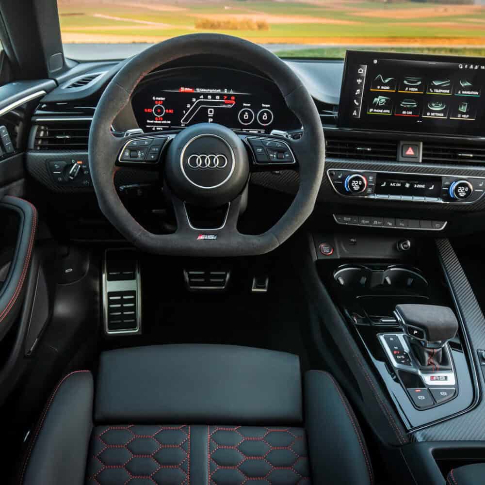 Interior of Audi RS5 with custom interior kit and advanced dashboard display.