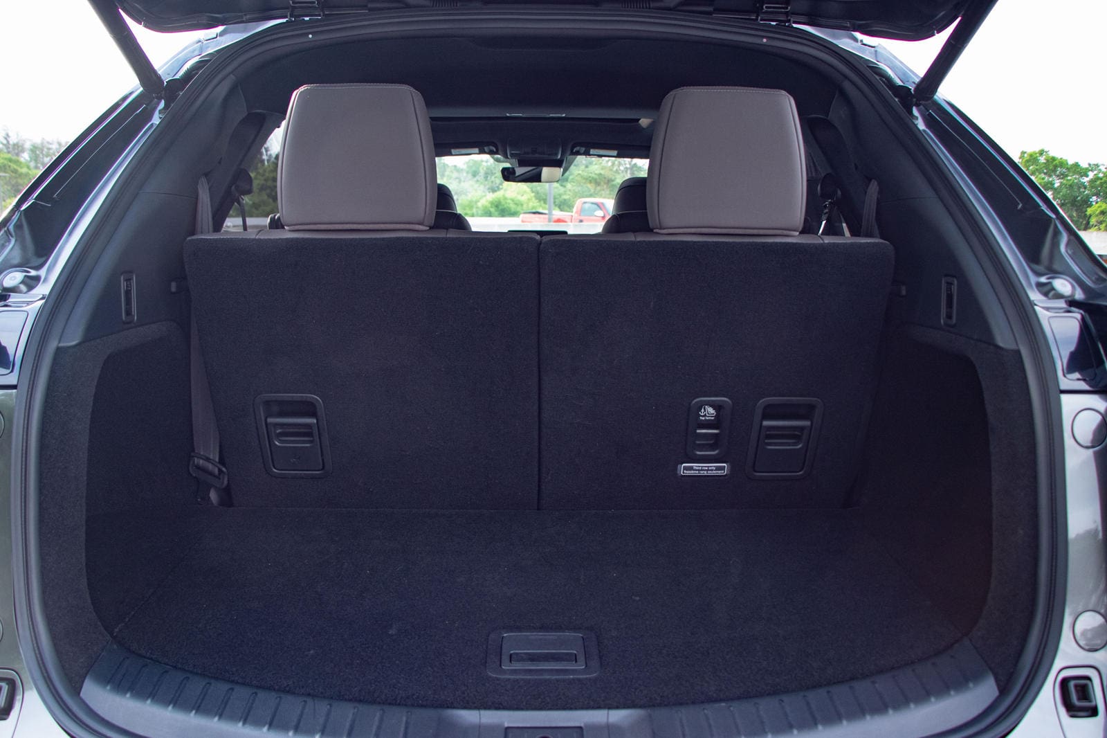 Mazda CX-9 trunk cargo organizer for enhanced storage and protection.