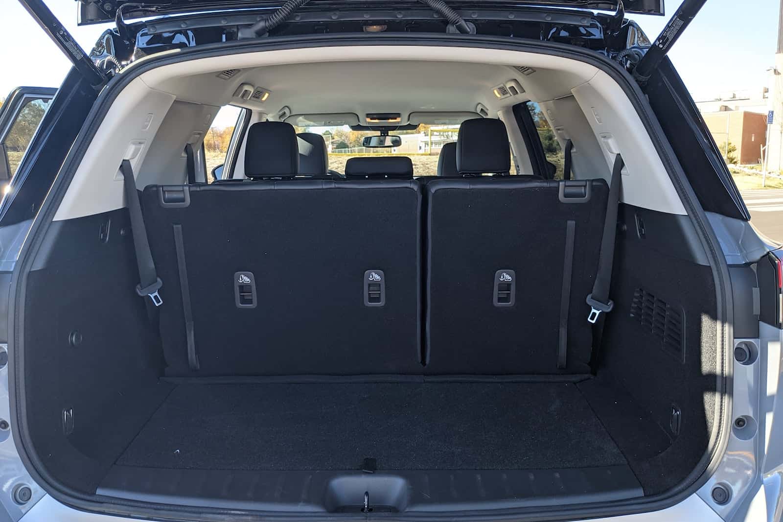 Nissan Pathfinder cargo area with luggage kit for organized storage.