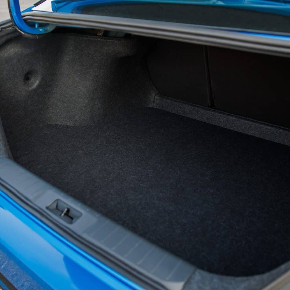 Luggage compartment of Nissan Sentra with custom-fit storage solution.